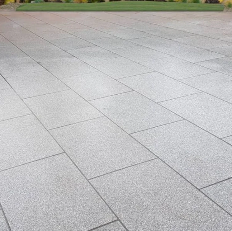 Gray stone patio with a grid pattern