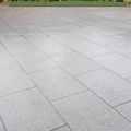Gray stone patio with a grid pattern