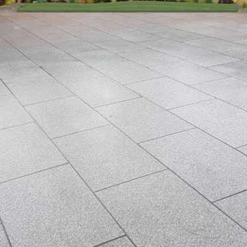 Gray stone patio with a grid pattern